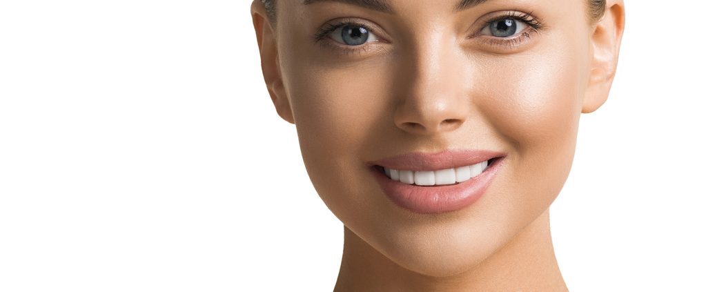 Beautiful teeth smile woman face healthy skin and teeth isolated on white